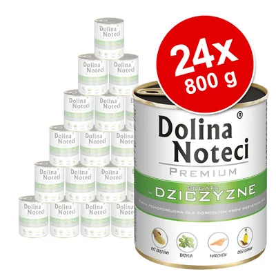 Set 24x800 g conserve Dolina Noteci Premium, text vizibil: BOGATA W DZICZYZNĘ, orez brun, busuioc, morcov, ulei de in. Ambalaj cu etichetă verde și albă.