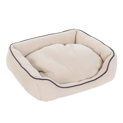 Cuscino rettangolare beige per pet con bordo rialzato e profilo scuro, materiale tessuto visibile. Cuscino rettangolare beige per pet con bordo rialzato e profilo scuro, materiale tessuto visibile.
