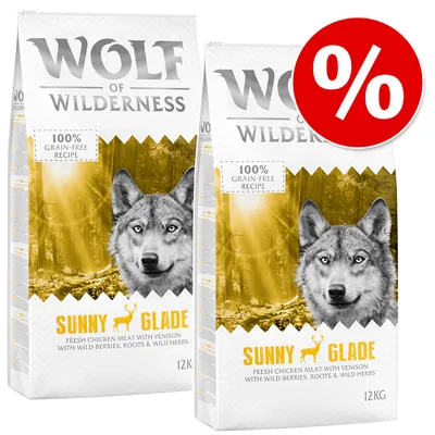 Lot de 2 sacs Wolf of Wilderness Sunny Glade 12 kg, recette sans céréales, viande de poulet et de cerf, baies sauvages, racines et herbes. Offre promotionnelle signalée par un symbole %.