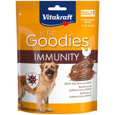 Vitakraft VITA Goodies Immunity, fremstillet i Tyskland, uden sukker, uden korn. Styrker immunforsvaret. Billede af hund og snack.