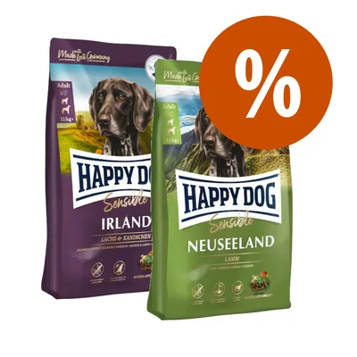 Due confezioni di crocchette Happy Dog Sensible: Irlanda (salmone e coniglio) e Neuseeland (agnello), 11 kg, con simbolo percentuale arancione per offerta.