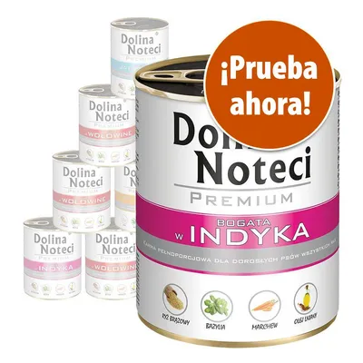 Lata de comida Dolina Noteci Premium, variedad Bogata w Indyką. Texto visible: ¡Prueba ahora!, ingredientes ilustrados: arroz integral, albahaca, zanahoria, aceite de linaza.