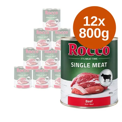 Zestaw 12 puszek Rocco Single Meat Beef, każda 800 g. Na etykiecie widoczne mięso wołowe i sylwetka krowy. Widoczny napis: Rocco SINGLE MEAT Beef.