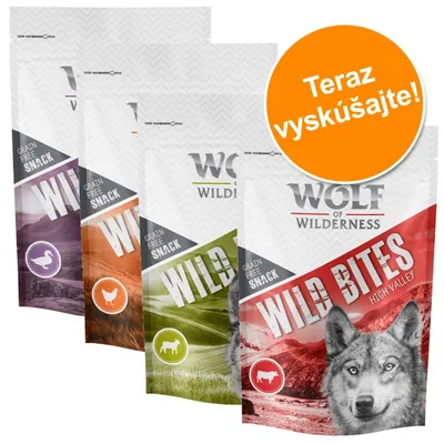 Wolf of Wilderness Wild Bites Grain Free Snack, štyri balenia rôznych príchutí. Viditeľný text: Teraz vyskúšajte!