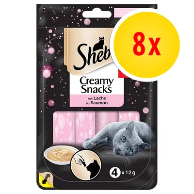 Sheba Creamy Snacks mit Lachs au Saumon, lot de 8, sachet avec 4 x 12 g, image d’un chat gris et crème en coupelle visibles sur l’emballage.