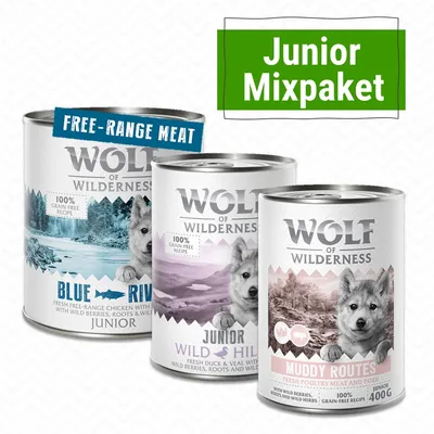 Wolf of Wilderness Junior Mixpaket: tre burkar våtfoder, smaker Blue River, Wild Hills och Muddy Routes. 100 % spannmålsfritt recept, synlig text 'Free-Range Meat', 400 g.