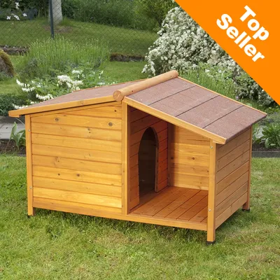 Hundkoja i trä med öppning framtill och tak av bruna plattor. Orange hörn med texten Top Seller.