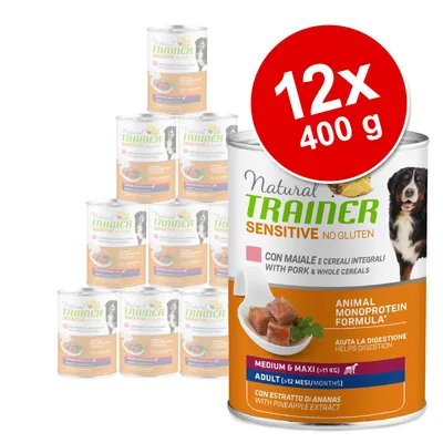 Pachet 12 x 400 g conserve Natural Trainer Sensitive No Gluten pentru câini, cu porc și cereale integrale. Pentru adulți de talie medie și mare. Text vizibil: ajută la digestie.