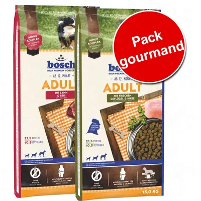 Deux sacs de croquettes bosch Adult pour chiens, 15 kg chacun : l’un mit Lamm & Reis, l’autre mit frischem Geflügel & Hirse. Texte visible : Pack gourmand, 21,5 % protéines, 10,5 % matières grasses.