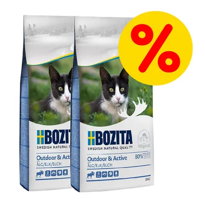Due sacchi di Bozita Outdoor & Active per gatti, 10 kg ciascuno, con immagine di gatto e simbolo percentuale rosso su sfondo giallo che indica offerta o sconto. Due sacchi di Bozita Outdoor & Active per gatti, 10 kg ciascuno, con immagine di gatto e simbolo percentuale rosso su sfondo giallo che indica offerta o sconto.