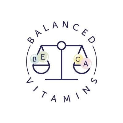 BALANCED VITAMINS with a scale holding BE and CA letters on coloured circles