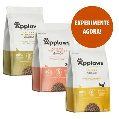 Três embalagens de ração seca Applaws para gatos adultos: Chicken with Lamb, Chicken with Salmon e Chicken. Texto visível: EXPERIMENTE AGORA!