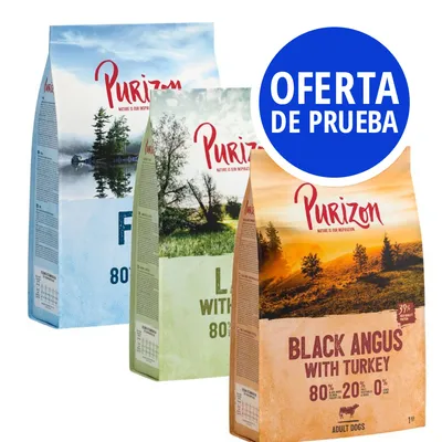 Tres sacos de pienso Purizon para perros: Fish, Lamb with Chicken y Black Angus with Turkey. Etiqueta azul visible: OFERTA DE PRUEBA. Texto en inglés en los envases.