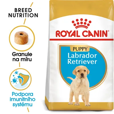 Balení Royal Canin Puppy Labrador Retriever, obrázek granule s textem Granule na míru, ikona a text Podpora imunitního systému, nápis BREED NUTRITION. Balení Royal Canin Puppy Labrador Retriever, obrázek granule s textem Granule na míru, ikona a text Podpora imunitního systému, nápis BREED NUTRITION.