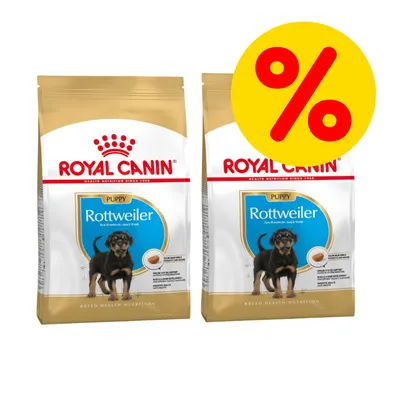 To poser Royal Canin Puppy Rottweiler hundefoder med billede af hvalp og stor gul procenttegn, tilbudsmarkering. Synlig tekst: 'Royal Canin', 'Puppy', 'Rottweiler'.
