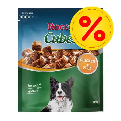 Rocco Cubes, friandises pour chien, saveur Chicken & Fish, sachet de 150 g avec offre promotionnelle indiquée par un symbole pourcentage jaune et rouge.