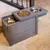 Feeding station with two stainless steel bowls and integrated dry food container, grey wood design.