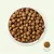 Bowl with brown dry food kibbles, single kibble shown with a diameter of 10 mm.
