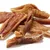 Assorted dried meat strips and chews displayed in a pile, showing texture and size for product comparison.