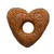 Bucată de hrană uscată în formă de inimă cu orificiu central, culoare maro, fără alte detalii vizibile sau text.
