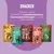 Mera Snacker in 5 Geschmacksrichtungen: Geflügel, Insekt, Rind, Lachs, Lamm. Ideal für Trainingserfolg. Verpackungen mit Bildern von Hunden und Snackstücken sichtbar.