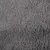 Detail van grijze stof met zichtbare textuur, mogelijk fleece of pluche materiaal.