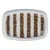 White feeding bowl with vertical grooves, filled with brown dry food pieces, for slow feeding.