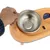 A hand places a stainless steel bowl into an orange food bowl with TiArK logo.