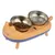 Double bowl made of stainless steel in orange-blue cat design, one bowl with dry food and one bowl for water.