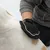 Grooming glove used on a white and brown dog.