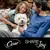 Cesar SHARE THE Joy. White dog sitting between two people on a sofa outdoors. Cesar brand name and slogan visible at the bottom.