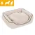 Panier beige en tissu pour animaux, taille S indiquée en haut à gauche avec pictogrammes chien et chat blancs sur fond orange. Panier beige en tissu pour animaux, taille S indiquée en haut à gauche avec pictogrammes chien et chat blancs sur fond orange.
