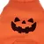 Orangefarvet stof med sort græskargesigt-print, egnet til Halloween-dekoration eller kostumer.