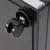 Close-up of a black plastic roller with metal mounting on a black housing.