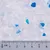 Close-up van witte en blauwe silicatestrooikristallen met een schaal in centimeters voor groottebepaling.
