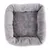 Grey, square pet bed made of soft plush material with raised edge.
