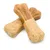 Dos snacks para perros en forma de hueso con aspecto bicolor: mitad superior marrón, mitad inferior beige con motas de hierbas.
