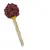 Snack in Lollipop-Form mit gelbem Kern, umhüllt von dunkler Masse und roten Stückchen. Stiel aus natürlichem Material.