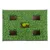 Toy with green grass mat and five rectangular openings, two yellow balls visible in one of the openings.
