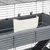 Grey metal cage with white feed trough attached to the inside of the cage. Suitable for small animals.