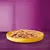 Chunks of brown pet food served in a round yellow bowl on a purple surface, no visible brand or text.