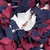 Close-up of a snuffle mat made of fabric strips in blue, red and white with hidden treats in the centre.