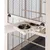Wooden frame with two stainless steel bowls, integrated into a cage design with black grid walls and wooden bars.