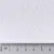Gránulos blancos con regla métrica en centímetros debajo, mostrando el tamaño aproximado de los granos entre 0 y 6 cm.