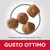 Quattro crocchette, dimensione circa 12 x 12 mm. Testo visibile: GUSTO OTTIMO.