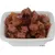 Primo piano di pezzi di carne in gelatina, serviti in una ciotola bianca.
