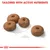 Four round kibble pieces shown with a 1cm scale and the text 'Tailored with active nutrients' above, highlighting nutrient content and kibble size.