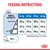 Feeding instructions table showing daily food amounts in grams for 26, 32, 38, and 44 kg dogs by activity level. Includes water reminder and metabolisable energy: 3014 kcal/kg.