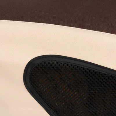 Détail de tissu beige et marron avec une partie en maille noire, matériaux visibles d’un produit textile pour animaux.