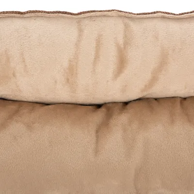 Nahaufnahme eines beigen, weichen Stoffmaterials mit gepolsterter Struktur, geeignet für Haustierbetten oder ähnliche Produkte.
